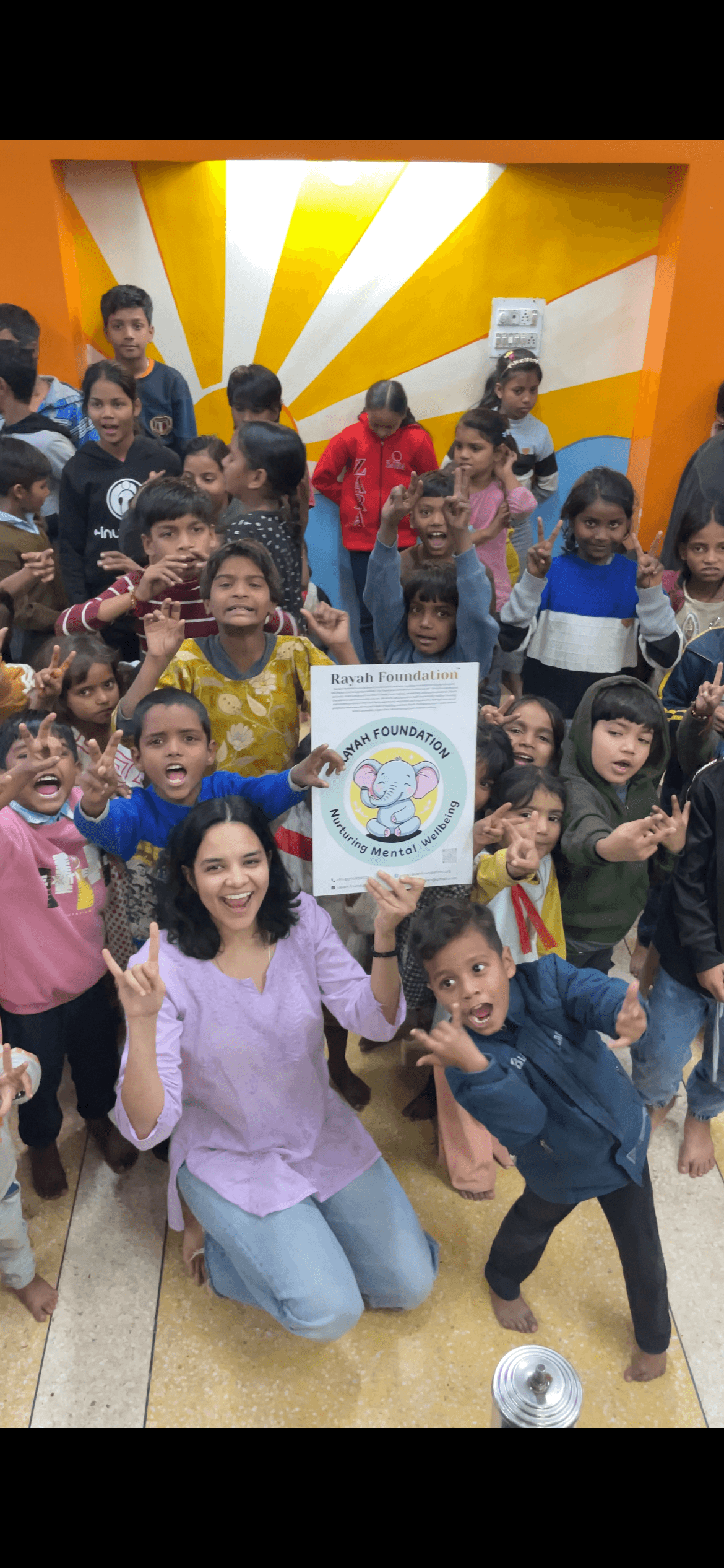 Rayah Minds facilitator with children during a joyful group session